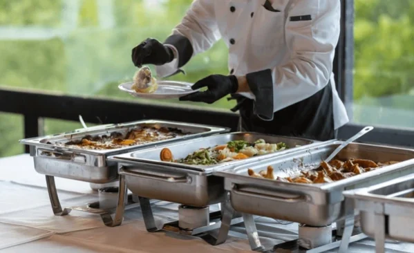 catering-staff-serves-food-buffet-600nw-2630302985